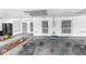 Attached two-car garage with painted walls and concrete floor at 4221 San Rafael Ave, New Port Richey, FL 34655