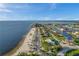 Picturesque aerial view of coastal homes, sandy beaches, and winding waterways at 4468 Rudder Way, New Port Richey, FL 34652