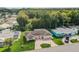 Aerial view of a well-maintained home with lush landscaping and a private driveway at 4468 Rudder Way, New Port Richey, FL 34652
