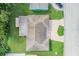 Birds eye view of a home with a clean roof, driveway, and grass at 4468 Rudder Way, New Port Richey, FL 34652