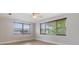 Bright bedroom with large windows and a ceiling fan at 4468 Rudder Way, New Port Richey, FL 34652