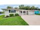 Well-maintained single-story home with a manicured lawn and a welcoming entrance at 4468 Rudder Way, New Port Richey, FL 34652