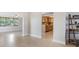 Open floor plan with tile flooring connects living and kitchen areas at 4468 Rudder Way, New Port Richey, FL 34652