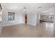 Bright and open room with tile floors and a large window, connecting to other rooms at 4468 Rudder Way, New Port Richey, FL 34652