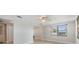 Bright and open room with tile floors and a large window, perfect for relaxing or entertaining at 4468 Rudder Way, New Port Richey, FL 34652