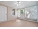 Bright sunroom with white walls, multiple windows and doors offers a relaxing space at 4468 Rudder Way, New Port Richey, FL 34652