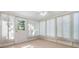 Bright sunroom with multiple windows and ceiling fan at 4468 Rudder Way, New Port Richey, FL 34652