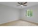 Bedroom with wood-look flooring and a window at 4595 Lake In The Woods Dr, Spring Hill, FL 34607