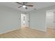 Neutral bedroom with wood-look floors and doorways at 4595 Lake In The Woods Dr, Spring Hill, FL 34607