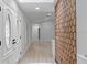 Bright foyer featuring wood-look flooring, recessed lighting, and eye-catching hexagonal wall design at 4595 Lake In The Woods Dr, Spring Hill, FL 34607