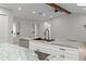Bright kitchen features granite counters, stainless steel appliances and white cabinets at 4595 Lake In The Woods Dr, Spring Hill, FL 34607