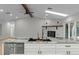 Bright kitchen features granite counters, stainless steel appliances and white cabinets at 4595 Lake In The Woods Dr, Spring Hill, FL 34607
