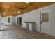 Covered patio area featuring tile flooring, a prep sink and access to the backyard at 4595 Lake In The Woods Dr, Spring Hill, FL 34607