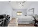 Well-lit bedroom with a ceiling fan, pool view, and adjacent work space at 5087 Oyster Ct, Spring Hill, FL 34607