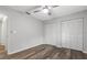 Bedroom features a ceiling fan and double closets at 5087 Oyster Ct, Spring Hill, FL 34607