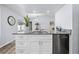 Stylish kitchen island with granite countertops and stainless steel dishwasher at 5087 Oyster Ct, Spring Hill, FL 34607