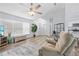 Comfortable living room with wood floors, a recliner, and plenty of natural light at 5087 Oyster Ct, Spring Hill, FL 34607
