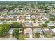 Expansive aerial view of a vibrant residential neighborhood with lush greenery and well-maintained homes at 5642 Dove Dr, New Port Richey, FL 34652