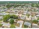 Birds-eye view of a quiet neighborhood with mature trees, offering a peaceful setting for single-Gathering homes at 5642 Dove Dr, New Port Richey, FL 34652