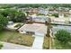 An aerial view of the home shows its proximity to neighborhood amenities and a private pool at 5642 Dove Dr, New Port Richey, FL 34652