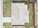 Aerial shot focusing on the roof and backyard of a property enclosed by a wooden fence at 5642 Dove Dr, New Port Richey, FL 34652