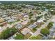 Neighborhood aerial view featuring well-maintained homes, tree-lined streets, and landscaped yards at 5642 Dove Dr, New Port Richey, FL 34652