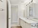 Bathroom with a white vanity, a mirror, and wood-look flooring at 5642 Dove Dr, New Port Richey, FL 34652