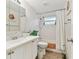 Bathroom featuring a white vanity, a mirror, and a shower/tub at 5642 Dove Dr, New Port Richey, FL 34652