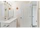 Bathroom with a white vanity, mirror, and white walls at 5642 Dove Dr, New Port Richey, FL 34652
