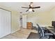 Bright bedroom features closet, workstation and ceiling fan at 5642 Dove Dr, New Port Richey, FL 34652
