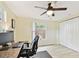 Bright bedroom featuring a window, closet and ceiling fan at 5642 Dove Dr, New Port Richey, FL 34652