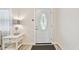 Clean entryway with light-colored walls, a decorative table, and a modern lamp at 5642 Dove Dr, New Port Richey, FL 34652