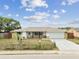 Well-kept single-story home showcases tidy landscaping and a welcoming front yard at 5642 Dove Dr, New Port Richey, FL 34652