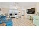 Spacious living room with modern furnishings, light wood floors, and ample natural light at 5642 Dove Dr, New Port Richey, FL 34652