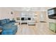 Comfortable living room boasts stylish furniture, light wood floors, and a welcoming atmosphere at 5642 Dove Dr, New Port Richey, FL 34652