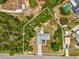 An aerial view of the home within property line shows the yard and nearby homes at 6197 Belkton Ave, Spring Hill, FL 34608