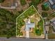 An aerial view of the home within property line shows the yard and nearby homes at 6197 Belkton Ave, Spring Hill, FL 34608