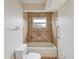 Cozy bathroom featuring a white tub, tiled shower, and convenient grab bars for added safety at 6197 Belkton Ave, Spring Hill, FL 34608
