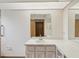 Bathroom with a long vanity, bright lighting, and a mirror at 6197 Belkton Ave, Spring Hill, FL 34608