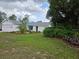Charming single-story home with well-maintained landscaping and a white exterior at 6197 Belkton Ave, Spring Hill, FL 34608