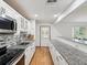 Modern kitchen featuring granite countertops, stainless steel appliances, and ample cabinet space at 6197 Belkton Ave, Spring Hill, FL 34608