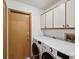 Laundry room with washer/dryer and overhead cabinets at 6197 Belkton Ave, Spring Hill, FL 34608