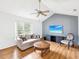 Comfortable living room with neutral decor, ceiling fan and hardwood flooring at 6197 Belkton Ave, Spring Hill, FL 34608