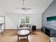 Comfortable living room with neutral decor, ceiling fan and hardwood flooring at 6197 Belkton Ave, Spring Hill, FL 34608