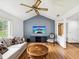 Comfortable living room with neutral decor, ceiling fan and hardwood flooring at 6197 Belkton Ave, Spring Hill, FL 34608