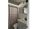 Bathroom area featuring a vanity, toilet, and a shower with a stylish shower curtain at 6406 Stone Rd, Port Richey, FL 34668