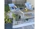 Charming backyard seating area with comfortable chairs, stylish coffee table, and relaxing ambiance at 6603 Adams St, New Port Richey, FL 34652