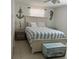 Bright bedroom with a comfortable bed, decorative accents, and natural light streaming through windows at 6603 Adams St, New Port Richey, FL 34652