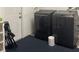 Modern laundry room with a washer and dryer at 6603 Adams St, New Port Richey, FL 34652