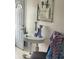 Welcoming living room with a decorative table, coastal themed wall art, and warm natural light at 6603 Adams St, New Port Richey, FL 34652